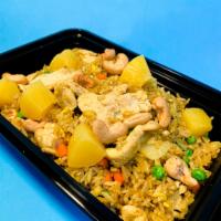 31. Pineapple Fried Rice · Choice of protein, egg, onions, peas, carrots, pineapple, cashew nut, yellow curry powder.