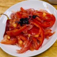 Achichuk Salad · Thin sliced tomatoes and onions seasoned with spices and basil.
