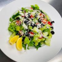 Greek Salad  · Chopped romaine lettuce, tomatoes, cucumbers, red onions, black olives, and feta cheese with...
