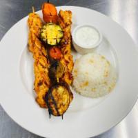 Chicken Kebab  · Marinated chicken grilled on skewers. Served with rice pilaf and grilled vegetables