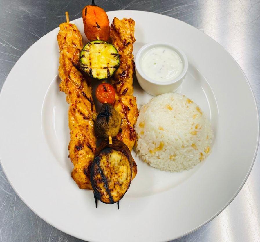 Chicken Kebab  · Marinated chicken grilled on skewers. Served with rice pilaf and grilled vegetables