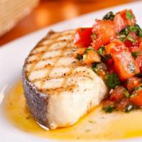 Halibut · Halibut seasoned & grilled. Served with rice pilaf and tomatoes.