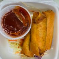 Vegetarian Roll · Grilled seitan and American cheese with spicy ketchup wrapped in egg roll sheets 