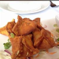  Crab Rangoon · Fried crab meat, scallions, carrots, with curry and cream cheese wrapped in wonton served wi...
