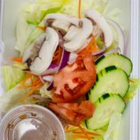 House Salad · Lettuce, cucumbers, mushrooms, carrot, tomato, red onions with peanut sauce dressing.