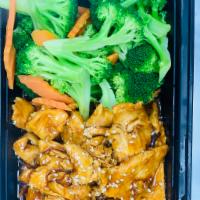 Chicken Teriyaki Stir-Fry · Chicken with teriyaki sauce served with steamed broccoli and carrots.