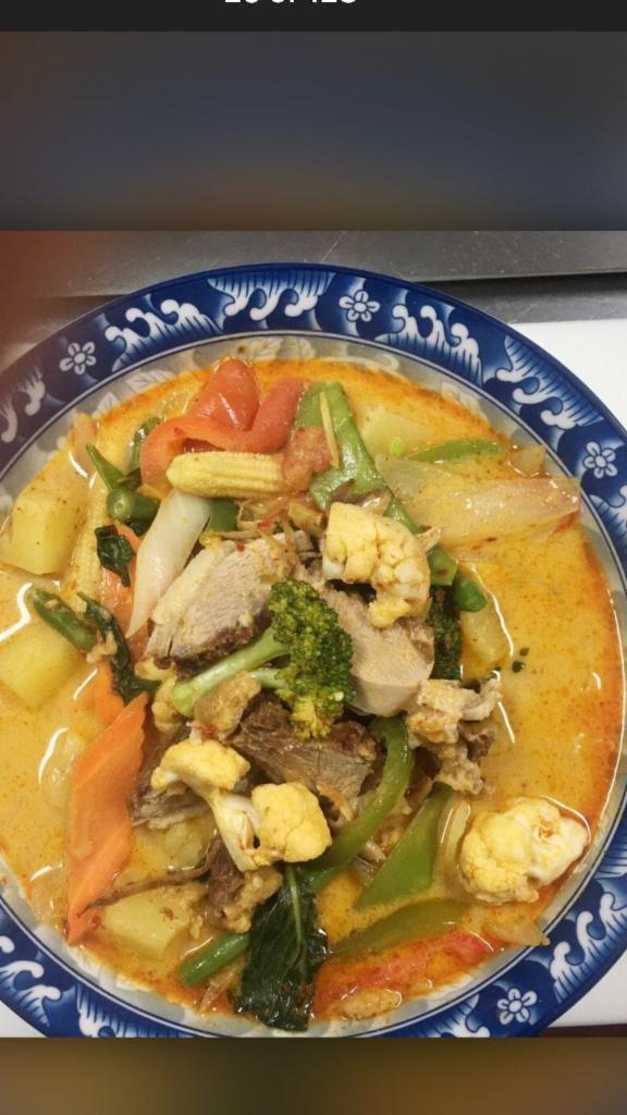 Thai Duck Curry (Kang Ped) · Bell peppers, onion, broccoli, carrot, pineapple and tomato, pepper corn, and fresh basil leaf.