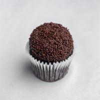 Chocoholic · Chocolate cake frosted with chocolate buttercream and topped with chocolate shavings.
