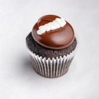 Chocolate Cream Cupcake · Chocolate cake frosted with fudge, and topped with buttercream.