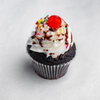 Hot Fudge Sundae Cupcake · Chocolate cake pinch filled with fudge, frosted with buttercream, and topped with sprinkles ...