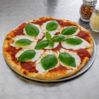 Margarita Pizza · Homemade marinara sauce, fresh basil, and fresh mozzarella cheese. 