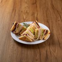 Turkey Club Sandwich · Served with coleslaw and potato chips and choice of bread.