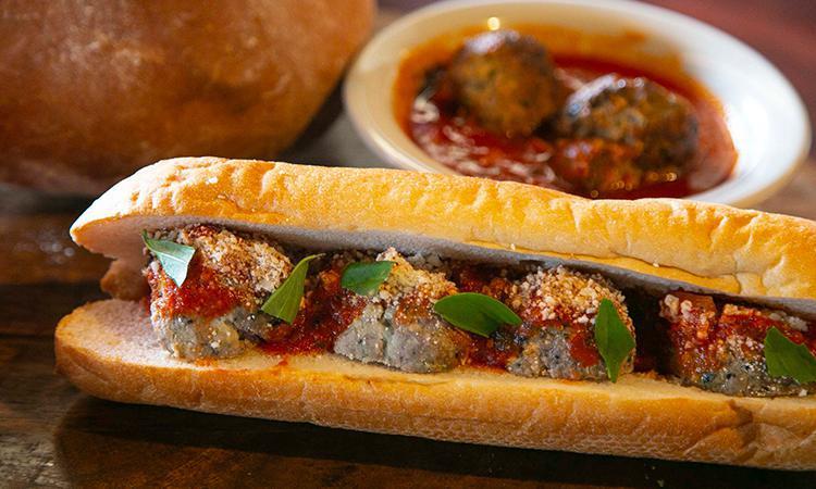 Meatball Parmesan Sandwich · Homemade beef and veal Italian meatballs, Russo's chianti-braised meat sauce, and Wisconsin mozzarella. 1,100 cal.