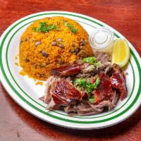 1 lb. Roast Pork Combo · 1 lb. roast pork with your choice of white rice and beans or yellow rice and pigeon peas, sa...