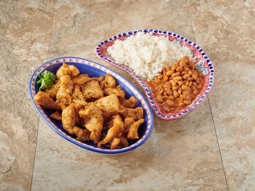 Chicharrones de Pollo sin Hueso · Boneless fried chicken chunks. Served with your choice of side.