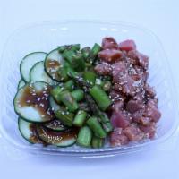 Poke Bowl · Rice, ahi tuna, hi poke sauce, cucumber salad, masago, ginger, sesame seed, and green onion.