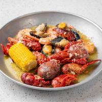 The Cajun Boil Combo · 1/2 lb crawfish, 1/2 lb black mussels, and 1/2lb head-off shrimp.