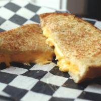 Plain Jane Sandwich · Melted American cheese grilled on sourdough bread.