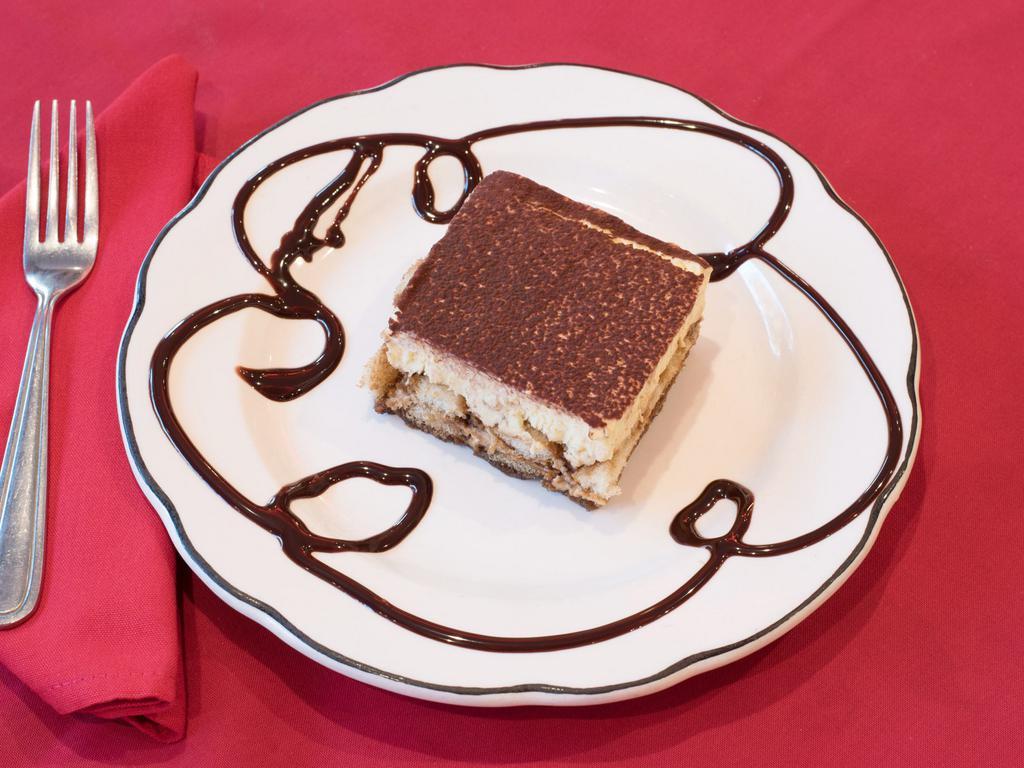 Tiramisu · Coffee soaked cake with chocolate and mascarpone cheese.