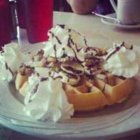 Banana Fosters Waffle · Bananas and walnuts topped with whipped cream.