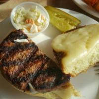 Hamburger · Char-grilled 8 oz. juicy prime meat burger. Served on a toasted brioche bun with coleslaw an...