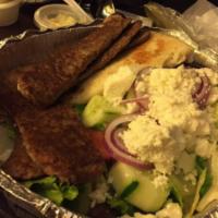 Gyro Platter · Juicy strips of lamb with plum tomatoes, lettuce, white onions and tzatziki sauce on toasted...