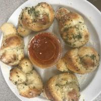 Garlic Knots (6) pieces  · Served with marinara sauce on the side 