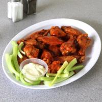 12 Piece Buffalo Wings · Served with celery and blue cheese dressing.