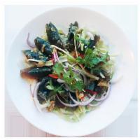 Yum Century Eggs · Preserved duck eggs salad in spicy chili lime dressing.