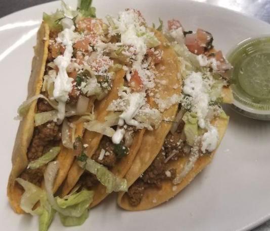 Hard shell tacos  · Crispy shells tacos, lettuce, tomato, sour cream and cotija cheese. Choice of shredded beef, ground beef or chicken tinga.