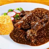 Mole Poblano · Concoction of blend  dry chiles, raisins, mix nuts, sweet platains, sesame seeds, spices and...