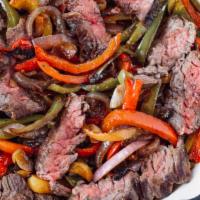Skirt Steak Fajita · Mix Bell peppers, Sauteed onions serve with Pico de gallo, Cheese, flour tortillas and Rice ...