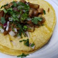 Carnitas Taco · Roast pork taco with cilantro & onions on soft corn tortillas. Salsa will be on the side.