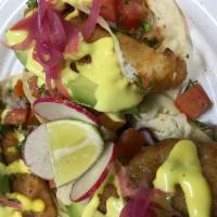 Pescado Baja Tacos (3) · Order of 3 pollock fish beer battered with Cabbage, Pico de Gallo, pickled red onions, Cream...