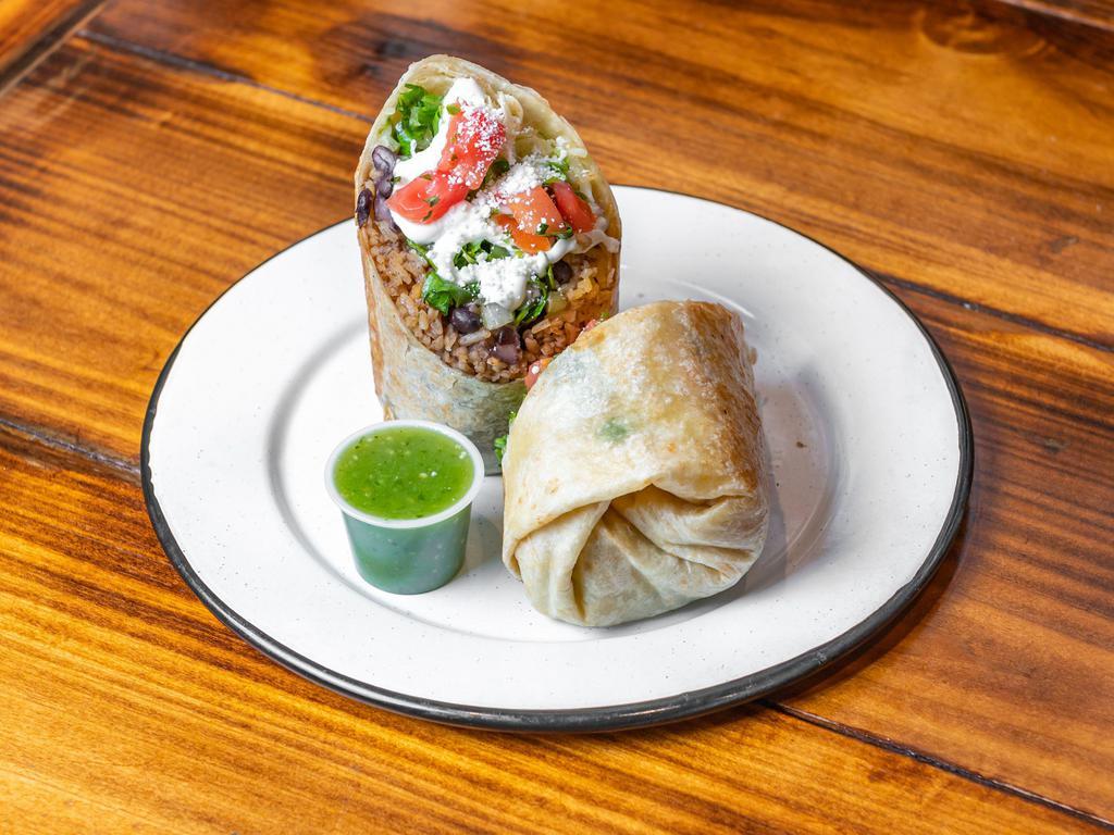Ground Beef Burrito · Ground Beef with Mexican rice & Beans, Jack cheese, Pico De Gallo and Lettuce. Both Sour cream & Salsa Verde on the side.