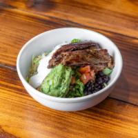 Carne Asada Rice Bowl · Grill top sirloin steak with Mexican rice & Beans, Jack cheese, Pico De Gallo, Lettuce, and ...