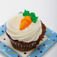 Spiced Carrot Cupcake · A carrot cake made with a blend of spices, fresh pineapple, carrots, and pecan topped with a...