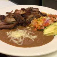 Carnitas · Delicious pork chop cooked to golden brown and served with rice, beans, sliced avocado, jala...
