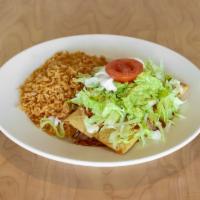Chimichanga · 2 fried or soft flour tortillas filled with chicken or beef tips and topped with melted chee...