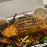 Grilled Salmon Salad · Served with onions, tomato, cheese, and croutons.