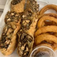 Jerk Chicken Egg Rolls · Handmade with onions, peppers, and cheese. Includes choice of fries or onion rings.