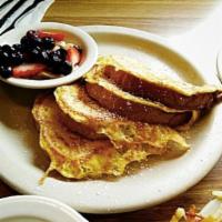 French Toast  · Thick sliced cinnamon French sourdough bread. Served with fresh seasonal fruit. 

