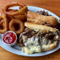 Philly Cheesesteak · Burien’s only authentic Philly!  A huge sandwich with a pile of thinly sliced rib eye steak ...
