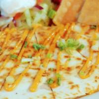 Quesadilla · Grilled flour tortilla stuffed with green chiles and blended cheese drizzled with chipotle m...