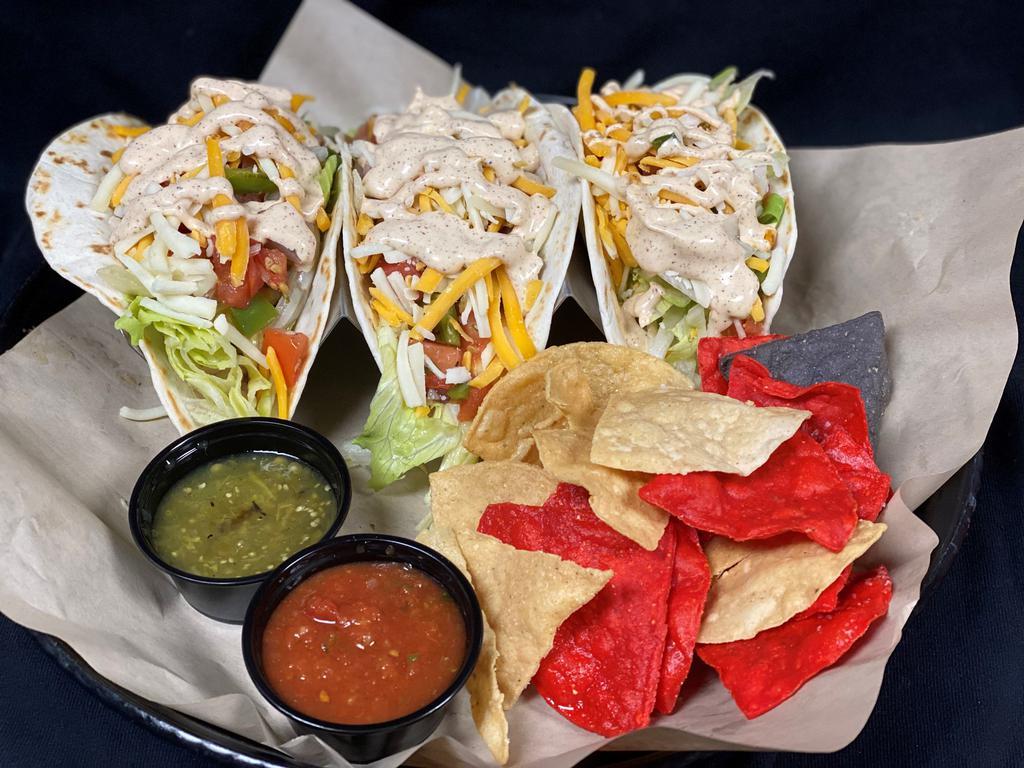 Taco Trio · 3 soft tacos, chicken, beef or fish with lettuce, pico, cheese and red or green salsa.