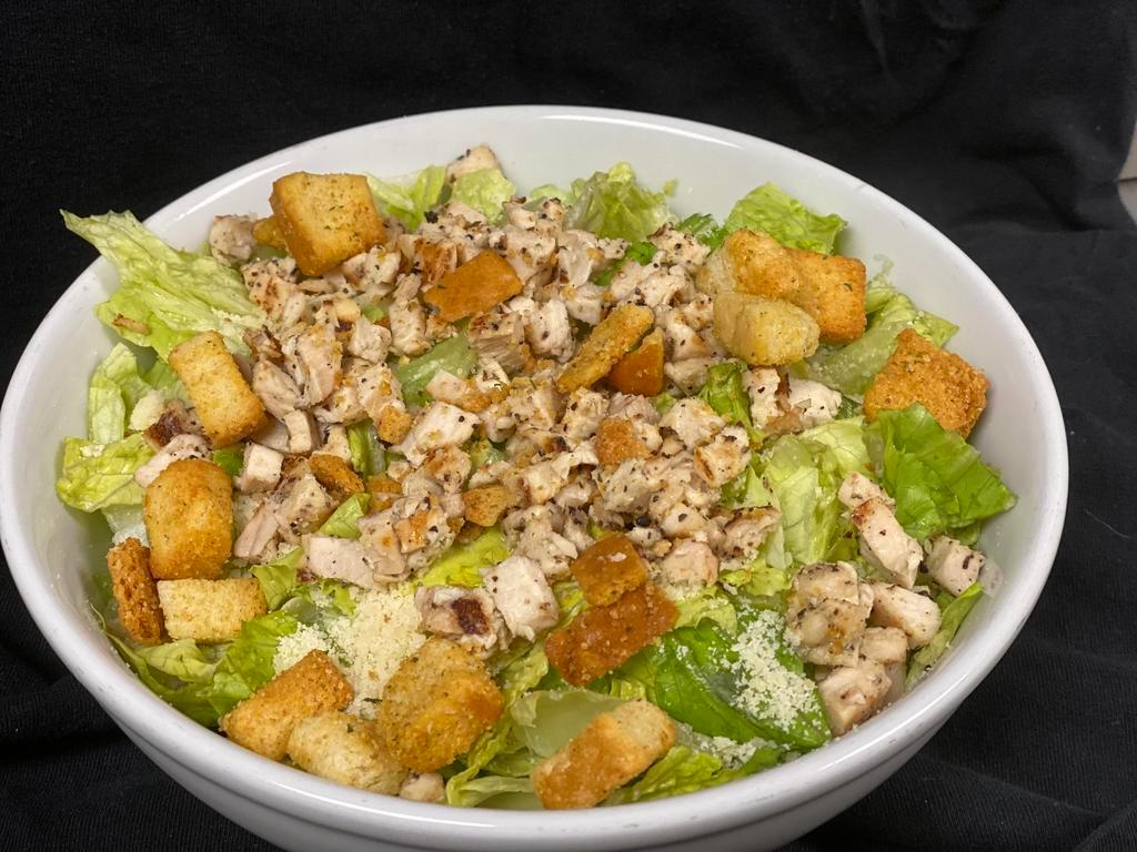 Classic Caesar Salad · Romaine lettuce tossed with Caesar dressing, Parmesan and croutons. Add grilled chicken for an additional charge.