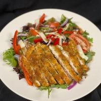 Herb Crusted Chicken Salad · Herb crusted chicken on a bed of spring mix with house made vinaigrette, red onions, red pep...