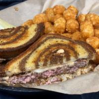 Marilyn's Melt · Sautéed onions, melted swiss, house made thousand island on grilled marble rye. Our Juicy Ha...