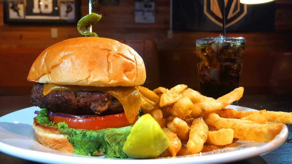 Chef's Stuffed Jalapeno Burger · Stuffed with cream cheese, bacon, diced jalapenos. Topped with cheddar, lettuce, tomato. Our Juicy Half Pound Angus Burgers are served with choice of French Fries, Rosemary Garlic Fries, Tater Tots or Coleslaw and a side of Bogeys Signature Sauce.