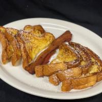 Santa Fe Toast · French toast topped with powdered sugar. Served with whipped butter and maple syrup. Add sid...